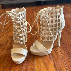 White lace-up heels. New condition.